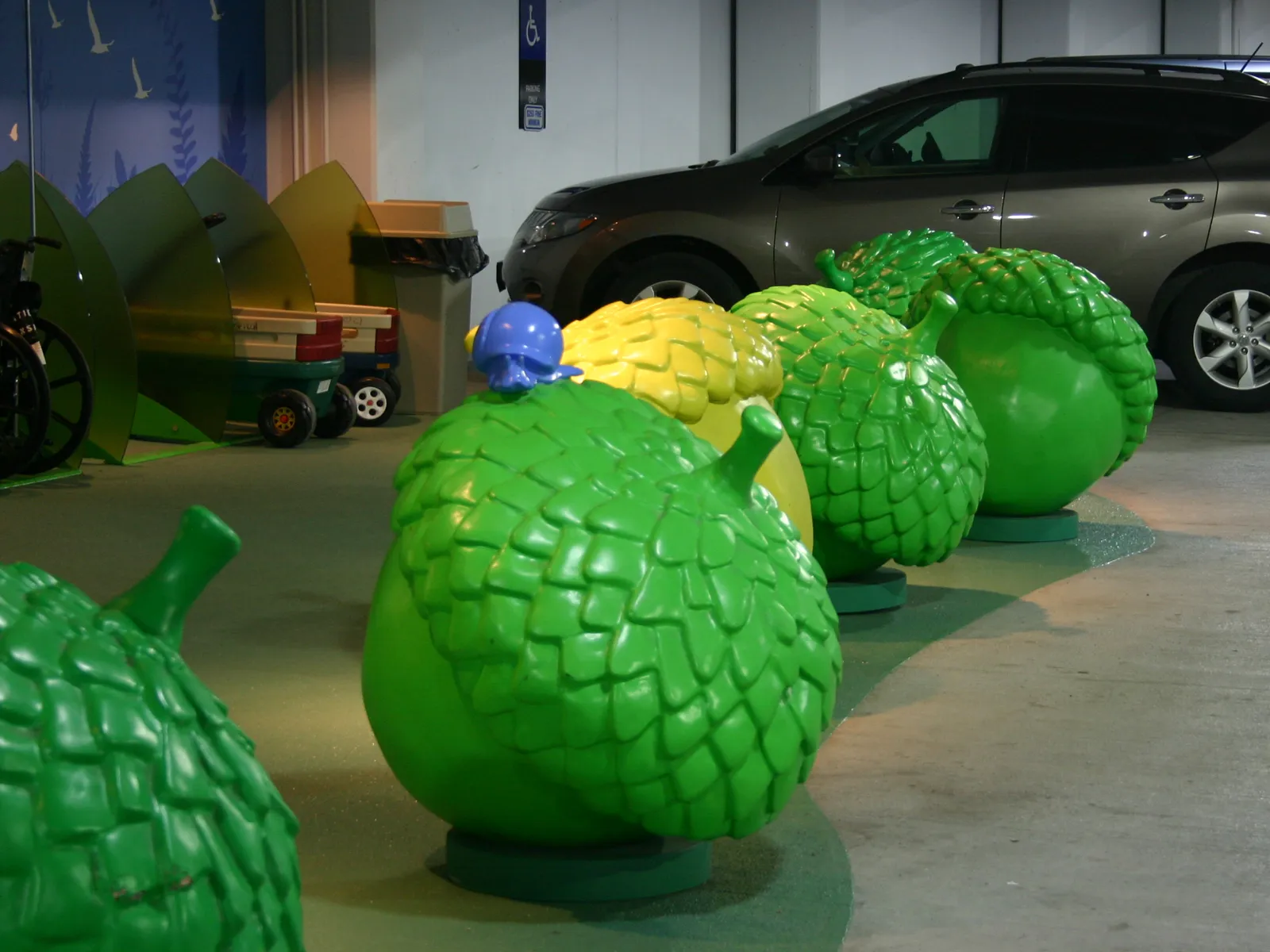 Large green and yellow acorn sculptures
