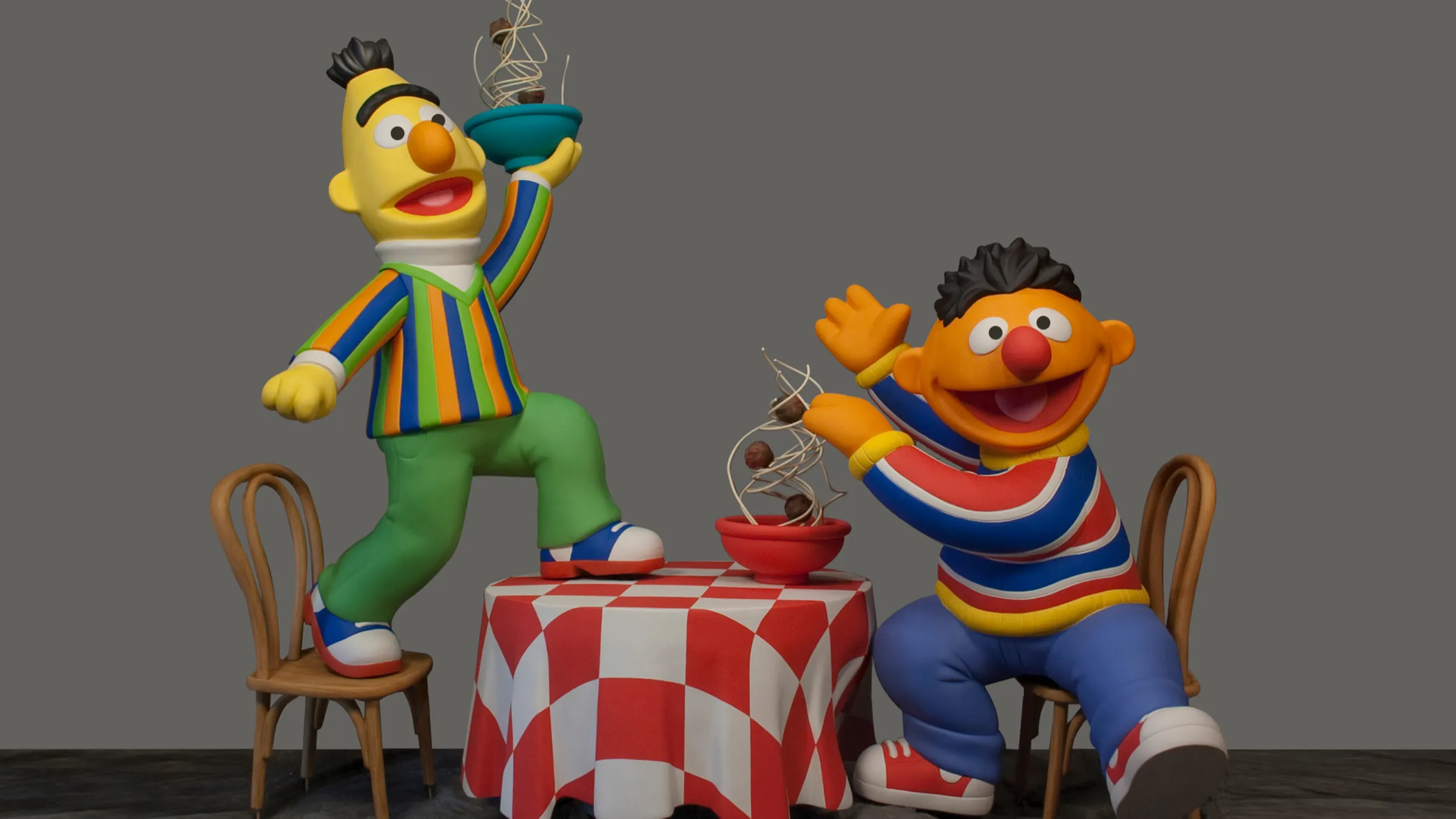 Figure of Bert and Ernie eating meatballs