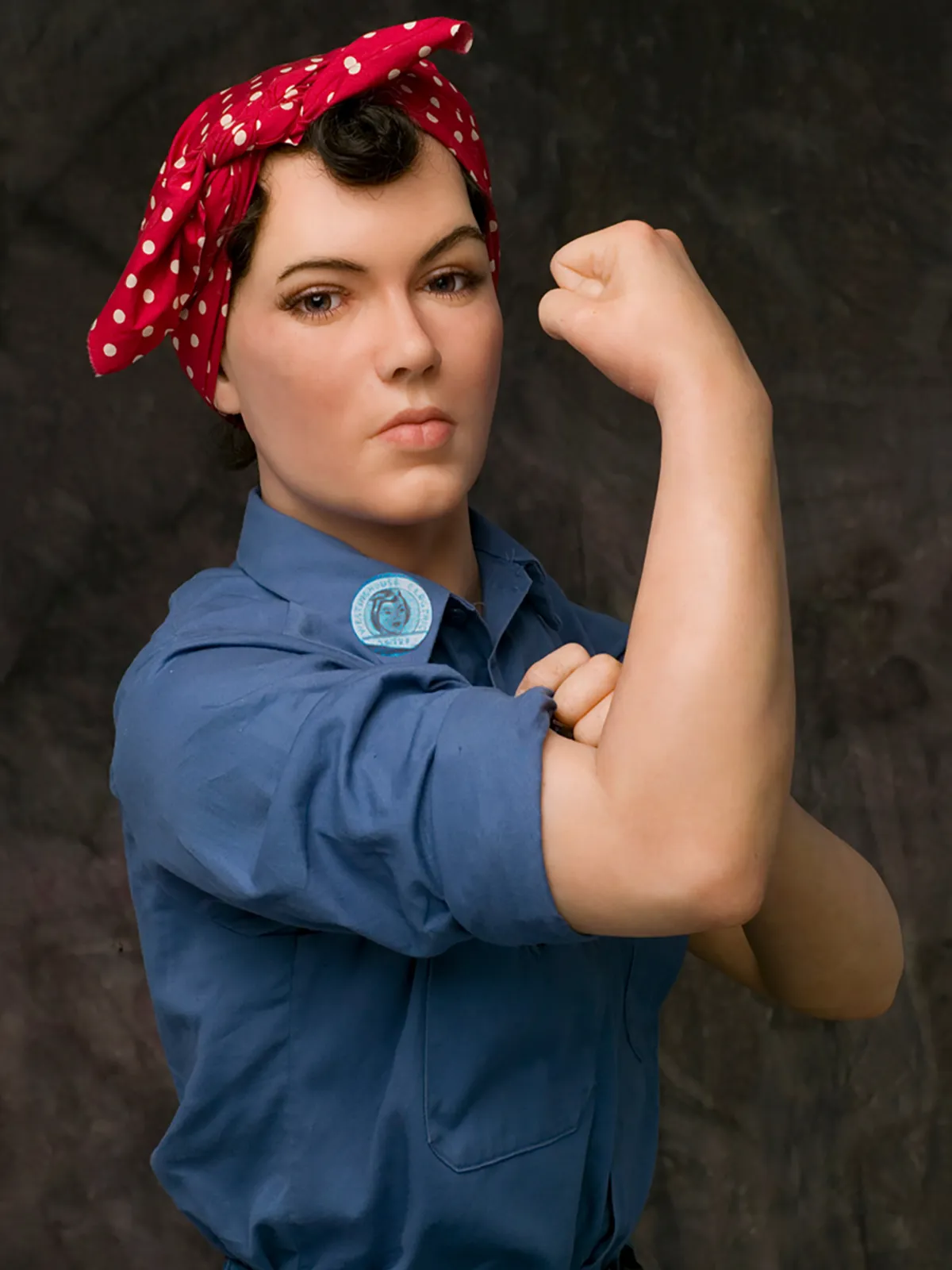 Figure of working woman flexing her muscles