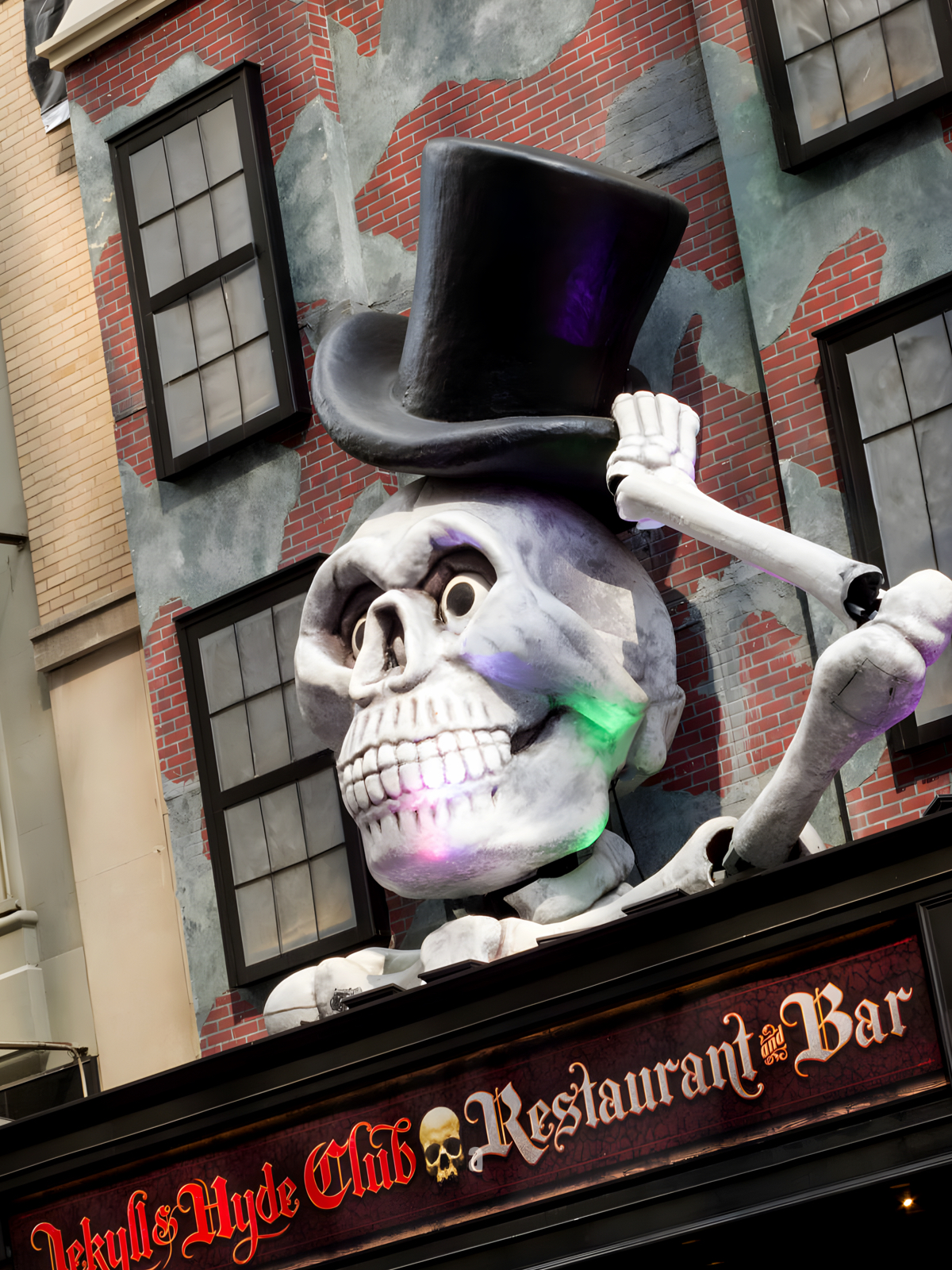 Jekyll & Hyde Club sign with large skeleton tipping his hat