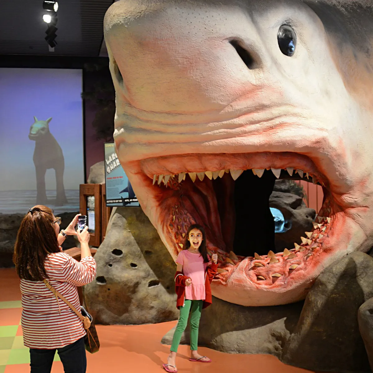 mother and daughter posing with megalodon