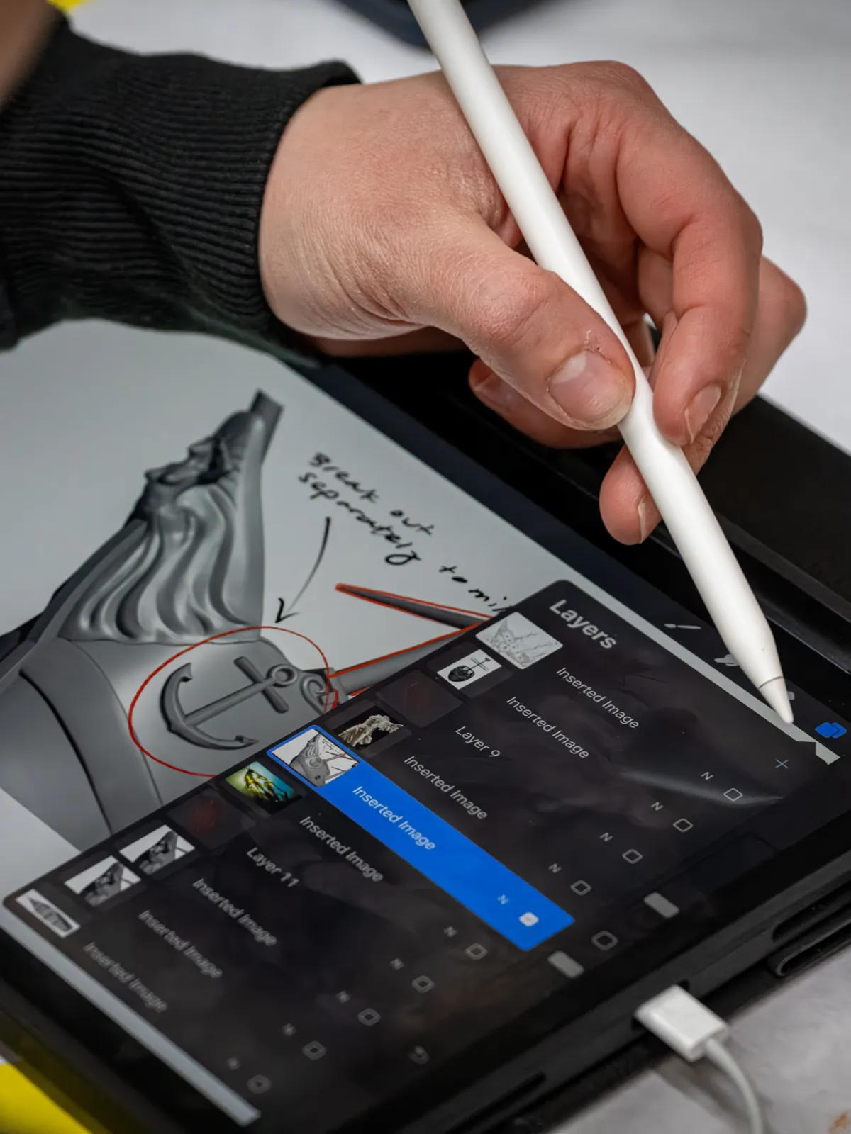 Artist planning work on a tablet